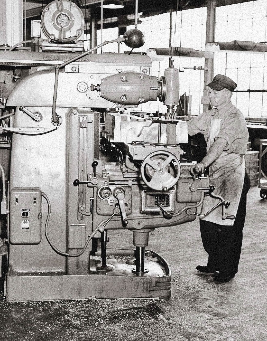 A patternmaker operating a Van Norman milling machine