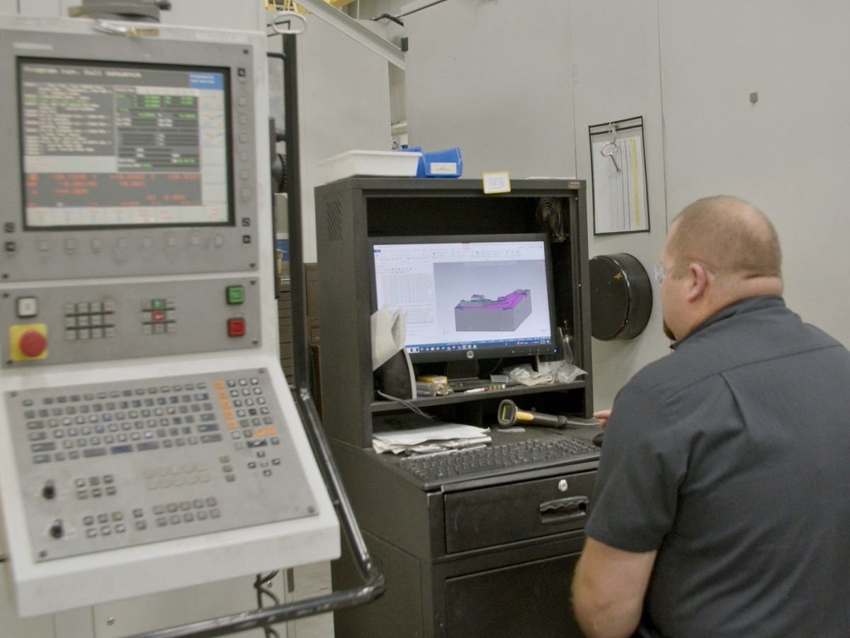 Anderson Global CNC operator working at a machining center