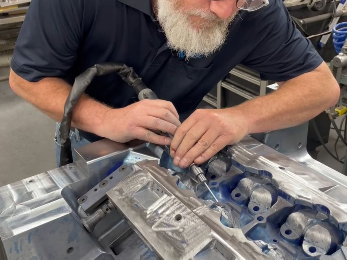 Anderson Global craftsman working precision foundry tooling by hand