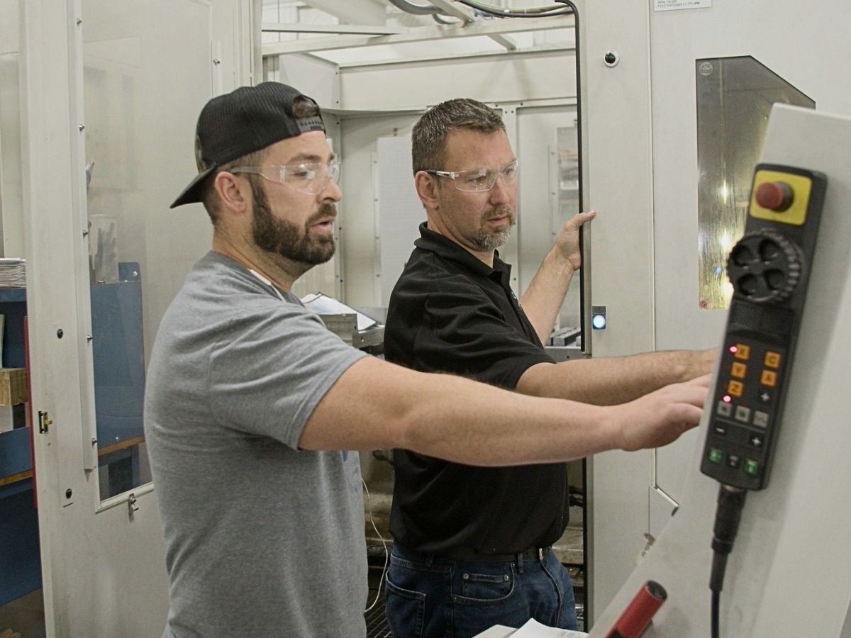 Anderson Global journeyman patternmaker at a modern CNC machine